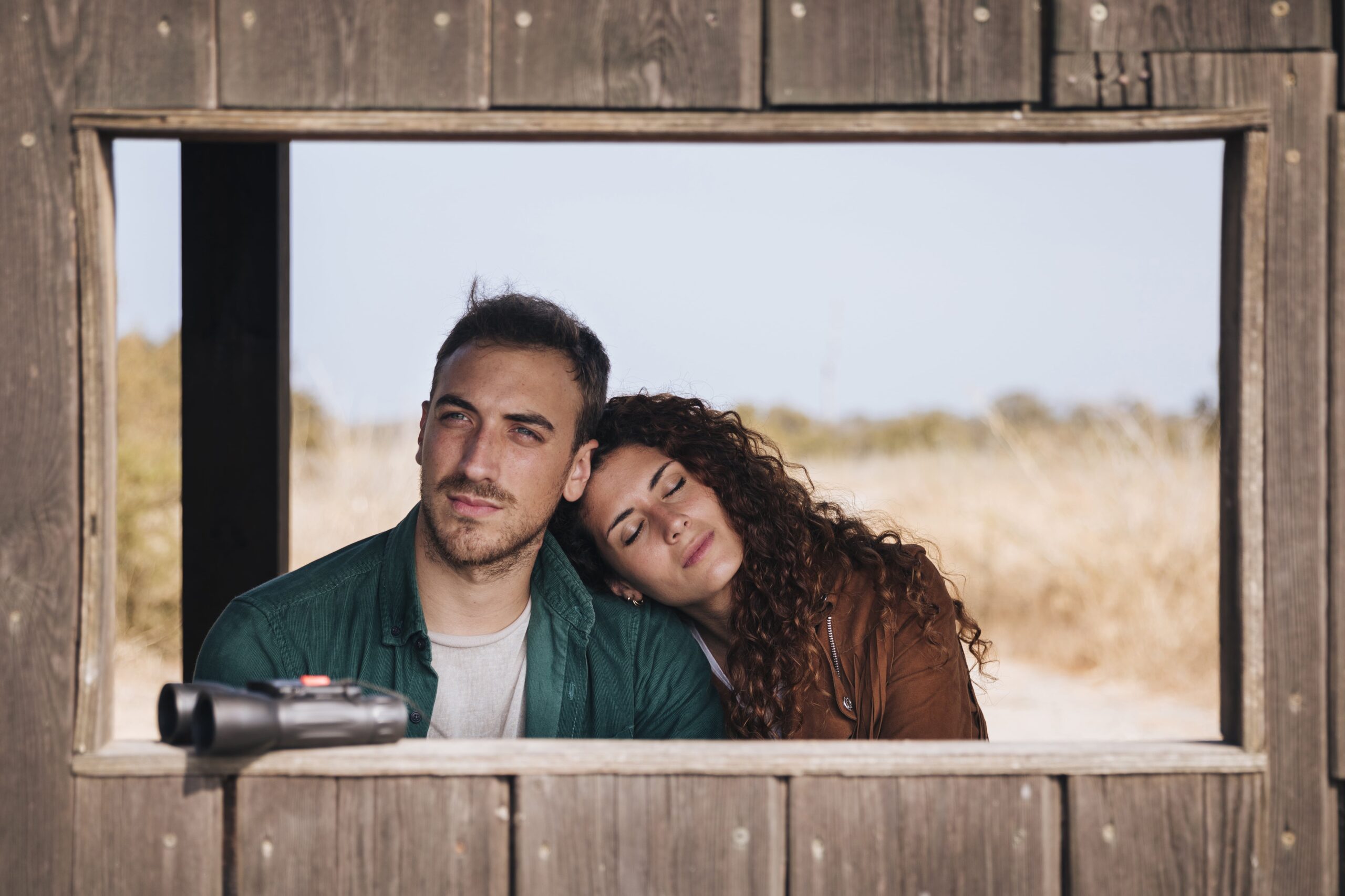 front-view-couple-bird-watching-shelter-min